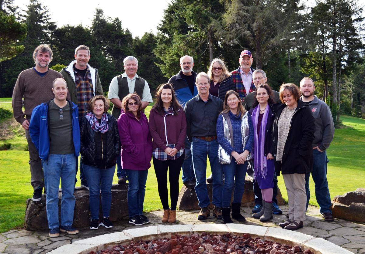 A group photo of the Council staff standing outside and smiling at the camera