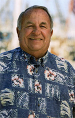 Smiling man in a Hawaiian shirt