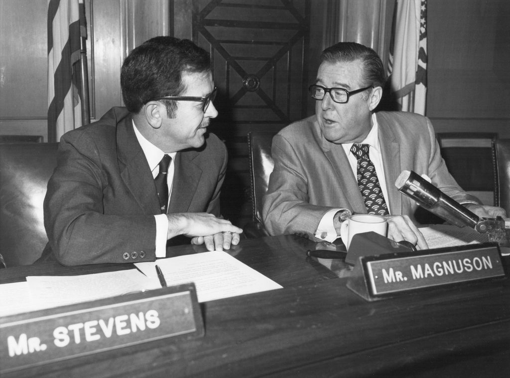 Black and white photo of two senators talking